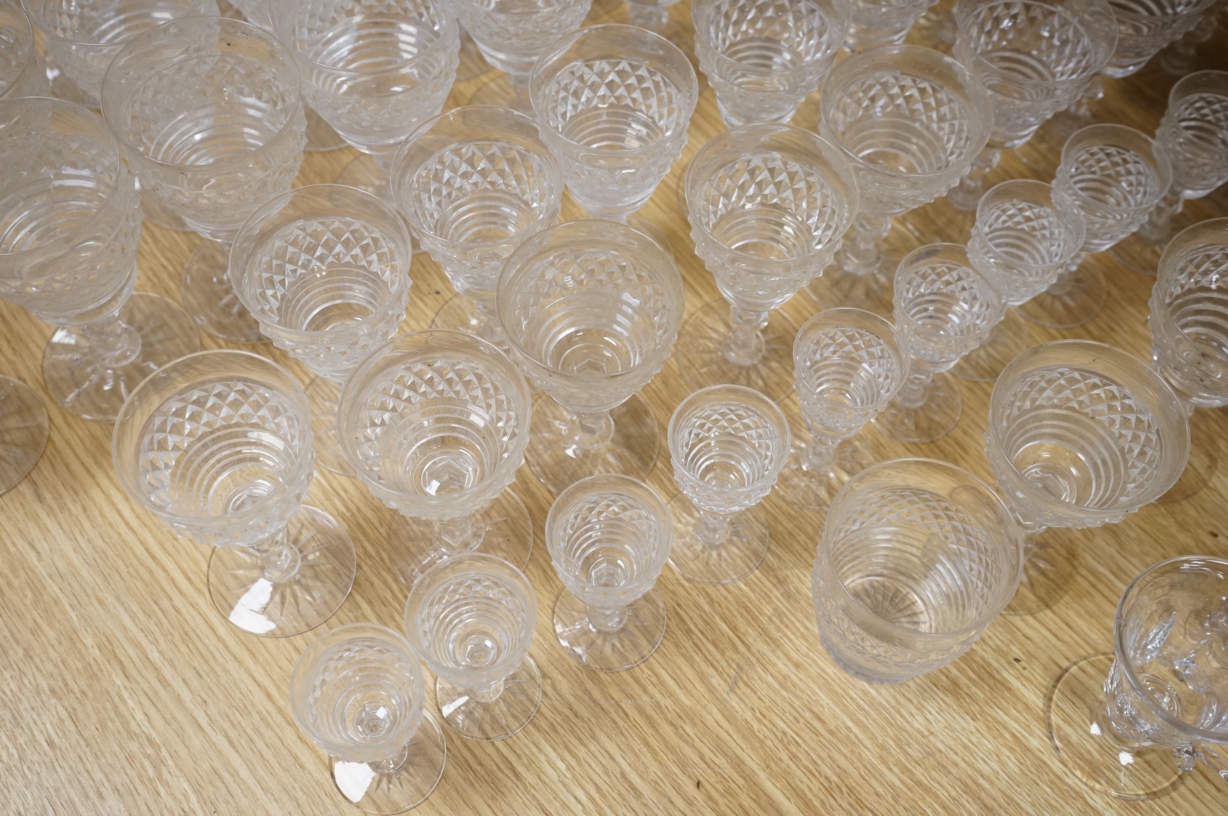 A suite of early 20th century cut table glass, custard glasses, a tall stemmed etched glass, etc., etched glass 24cm high